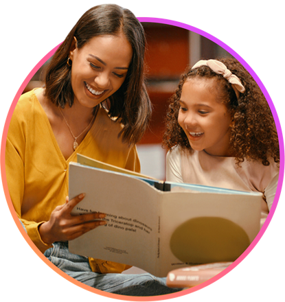 A teacher reading a book with a young student