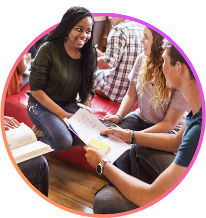 Three young educators discussing lesson plans